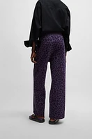 NAOMI x BOSS tracksuit bottoms with leopard print