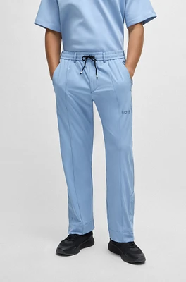 Relaxed-fit trousers with double-monogram badge
