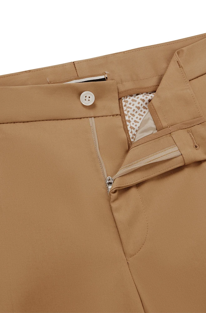 Pantalones relaxed fit de algodón elástico con cierre botón