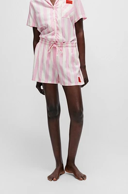 Patterned pajama shorts with red logo label