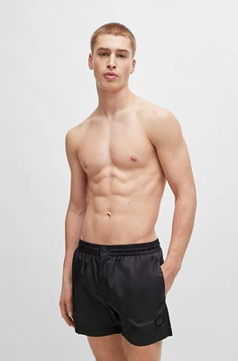 Fully lined quick-dry swim shorts with double monogram