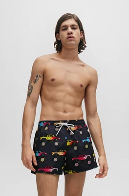 Quick-dry swim shorts with monster-truck print