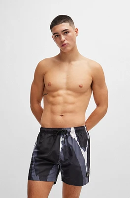 Seasonal-print quick-dry swim shorts with metallic logo
