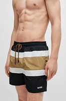 Quick-dry swim shorts with block stripes