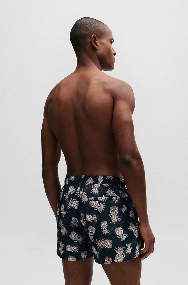 Fully lined swim shorts with pineapple motif