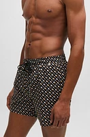 Fully lined quick-dry swim shorts with monogram print