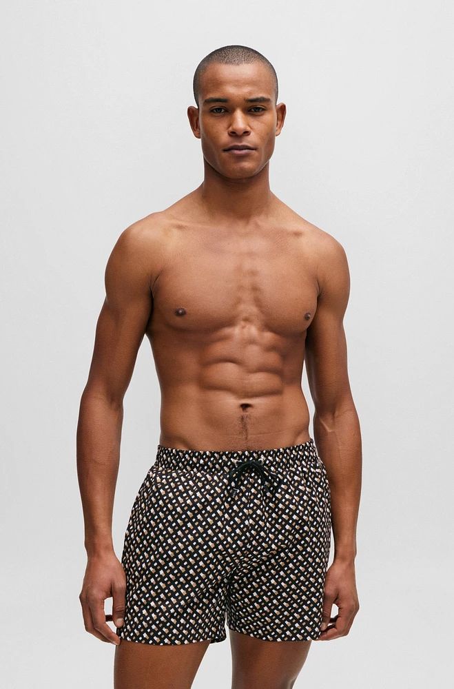 Fully lined quick-dry swim shorts with monogram print