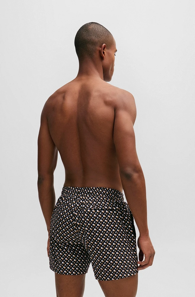 Fully lined quick-dry swim shorts with monogram print