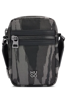 Stacked-logo reporter bag with seasonal pattern