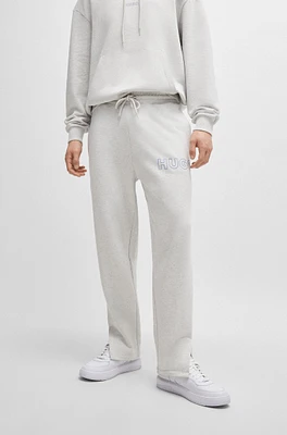 Loose-fit cotton-terry tracksuit bottoms with outline logo