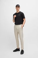 Tracksuit bottoms stretch fabric with decorative reflective logo