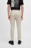 Tracksuit bottoms stretch fabric with decorative reflective logo