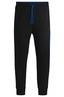 Stretch-cotton tracksuit bottoms with embossed artwork