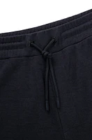 Regular-fit tracksuit bottoms performance fabric