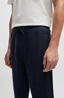 Regular-fit tracksuit bottoms performance fabric