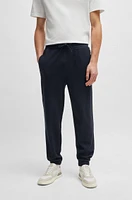 Regular-fit tracksuit bottoms performance fabric