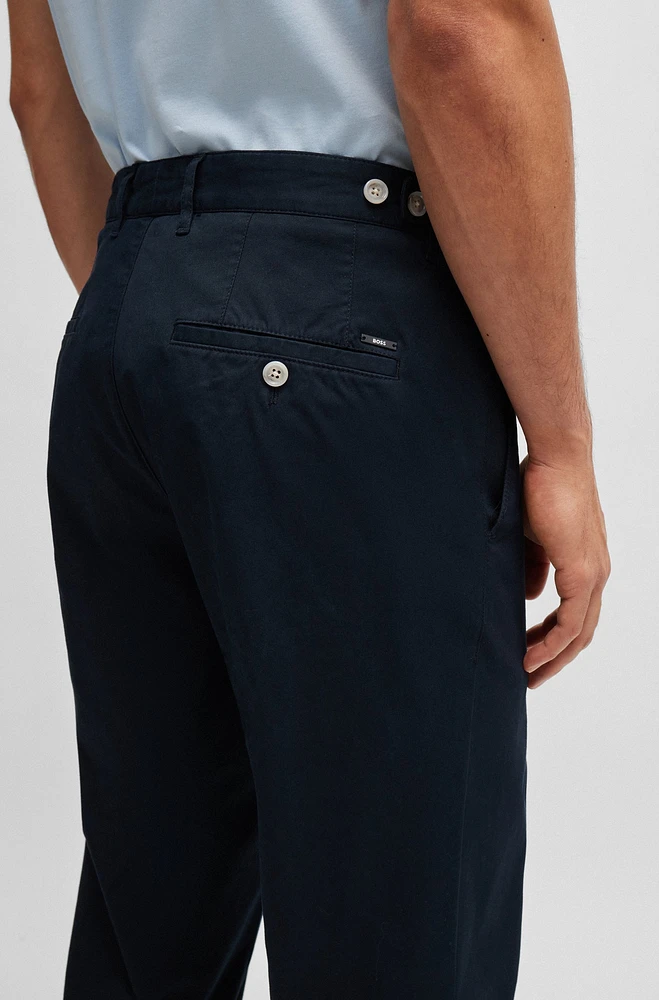 Pantalones slim fit en algodón elástico