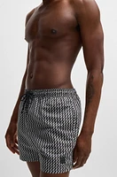 Logo-label swim shorts with seasonal pattern