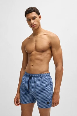 Drawstring-waist swim shorts with all-over print