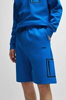 Shorts with decorative reflective logo