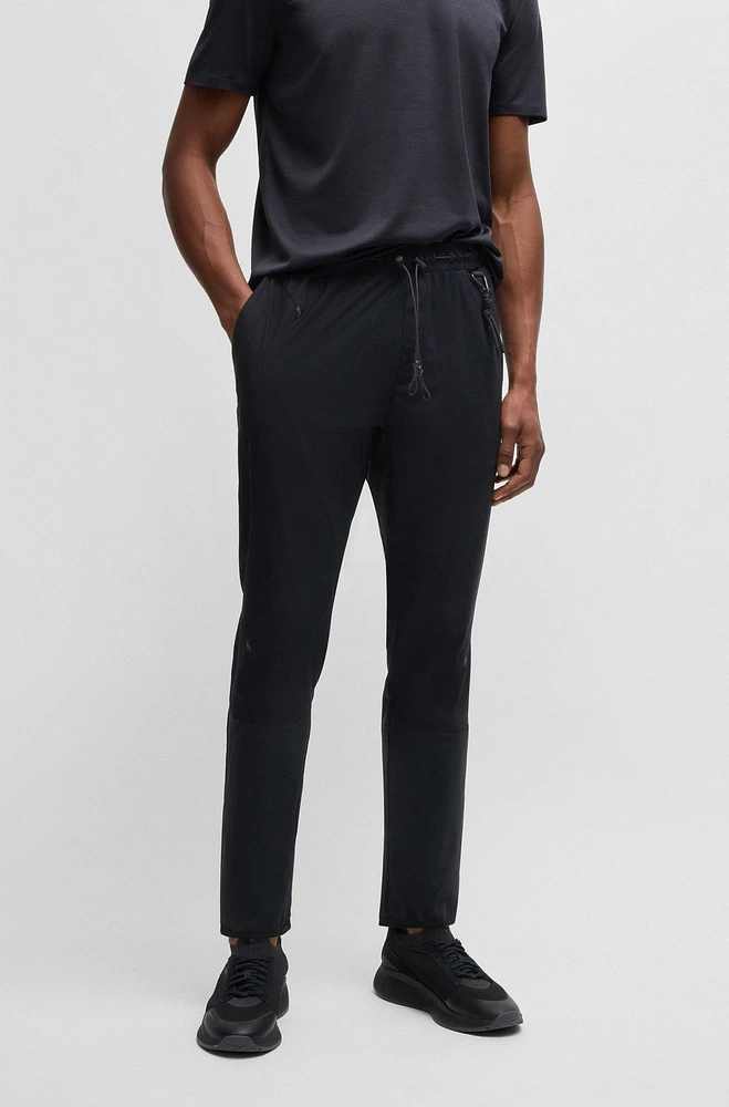 Regular-fit tracksuit bottoms with quick-dry performance