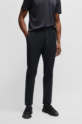 Regular-fit tracksuit bottoms with quick-dry performance