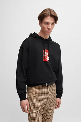 Cotton-terry hoodie with travel-tag artwork