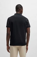 Polo shirt with embossed stripe artwork