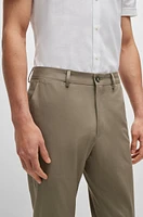 Pantalones slim fit en algodón elástico con seda