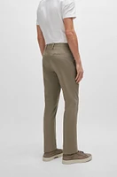 Pantalones slim fit en algodón elástico con seda