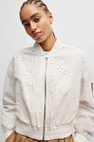 Embroidered bomber jacket with zipped sleeve pocket