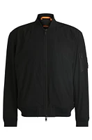 Water-repellent jacket with zipped sleeve pocket