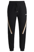 Cotton-terry tracksuit bottoms with signature-stripe tape