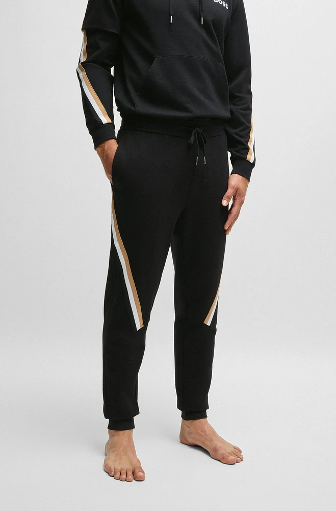 Cotton-terry tracksuit bottoms with signature-stripe tape