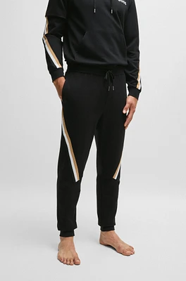 Cotton-terry tracksuit bottoms with signature-stripe tape