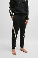 Cotton-terry tracksuit bottoms with signature-stripe tape