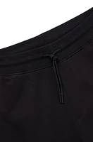 Cotton-terry tracksuit bottoms with smiley-face logo patch