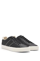 Faux-leather trainers with plain and grained textures