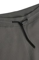 Regular-fit knitted tracksuit bottoms with stripes and branding