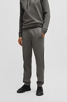 Regular-fit knitted tracksuit bottoms with stripes and branding