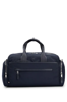 BOSS - Logo-trimmed holdall in structured nylon with smart sleeve - Dark Blue