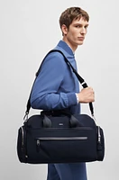 BOSS - Logo-trimmed holdall in structured nylon with smart sleeve - Dark Blue