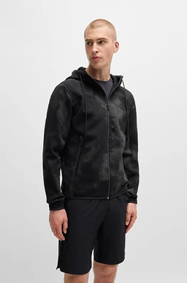 Zip-up hoodie with decorative reflective artwork