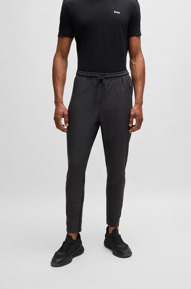 Active-stretch tracksuit bottoms with decorative reflective details