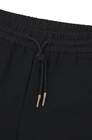 Tracksuit bottoms with adjustable hems