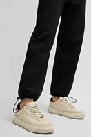 Tracksuit bottoms with adjustable hems