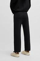 Tracksuit bottoms with adjustable hems