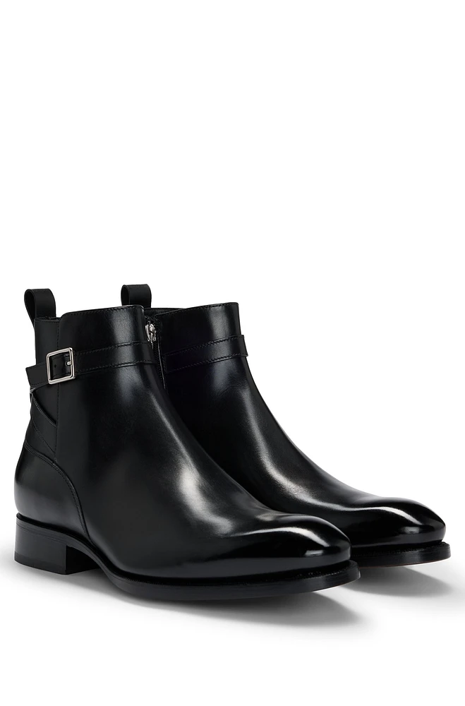 Leather jodhpur boots with zip closure and buckled strap