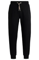 Tracksuit bottoms with signature-stripe cords