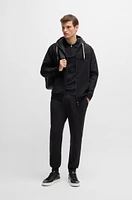 Tracksuit bottoms with signature-stripe cords